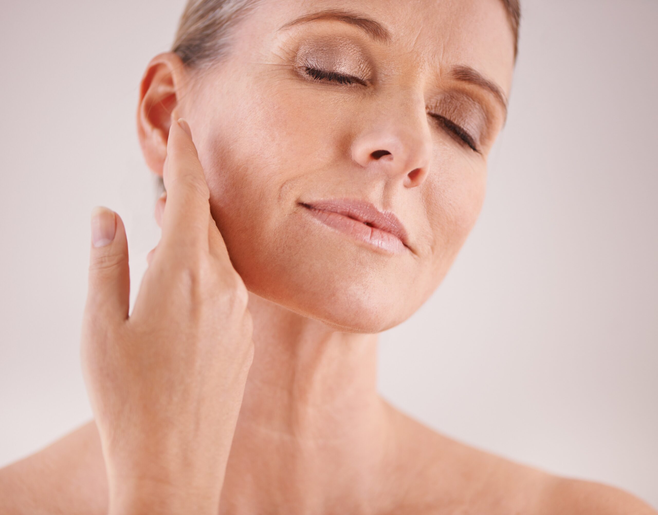Profhilo – Face beauty skincare with old woman studio gray background natural antiaging treatment facial skin care welln